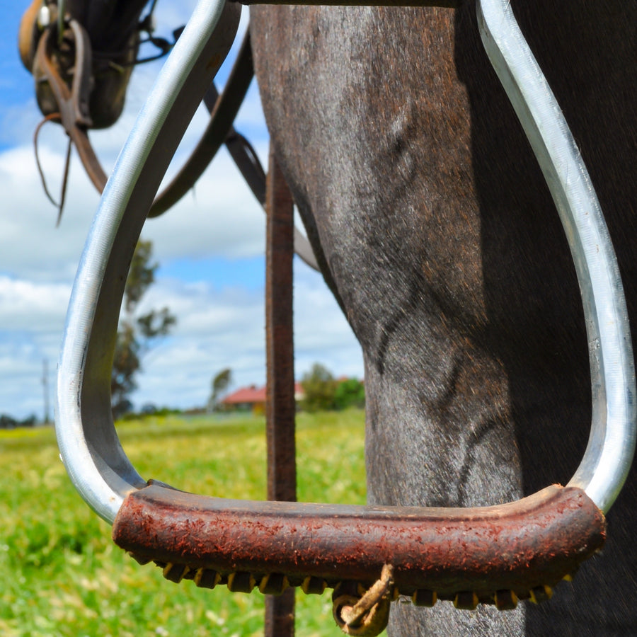 leather tread oxbows on horse saddle